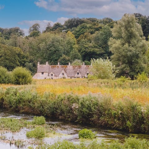 Visit Bibury, only a short drive, as you explore The Cotswolds