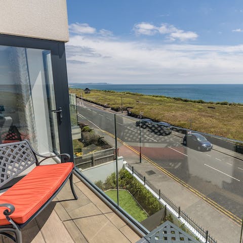 Take in the sea views from the bench on the balcony