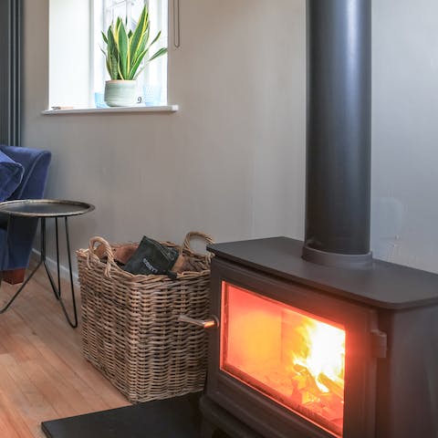 Get a fire going in the wood-burning stove and keep the place cosy warm