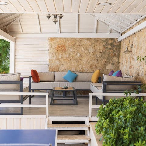 Escape the sun in this comfortable and covered outdoor seating area