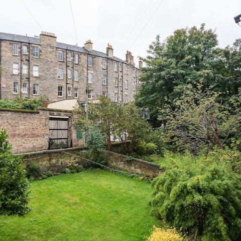 Admire pretty views of the historic tenements and lush neighbouring gardens
