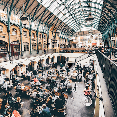 Explore Covent Garden's luxury boutiques and upscale eateries, a three-minute walk away