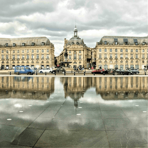 Stroll into the historic centre of Bordeaux until you reach Place de la Bourse and Miroir d'eau