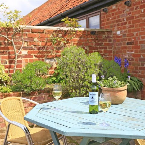 Enjoy a couple of glasses of wine on your flourishing patio