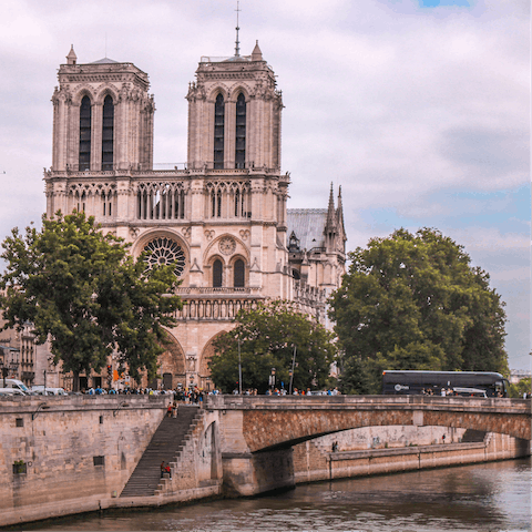Wander along the Seine and visit Notre Dame, ten minutes away on foot