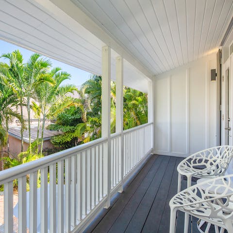 Settle in on the French-style balcony with a cold drink