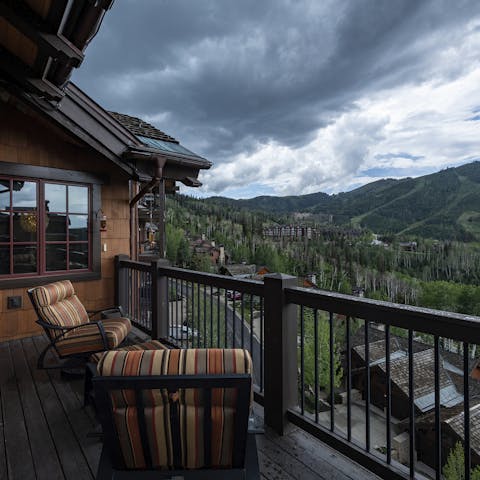 Look out over the breathtaking mountain landscape from your private balcony