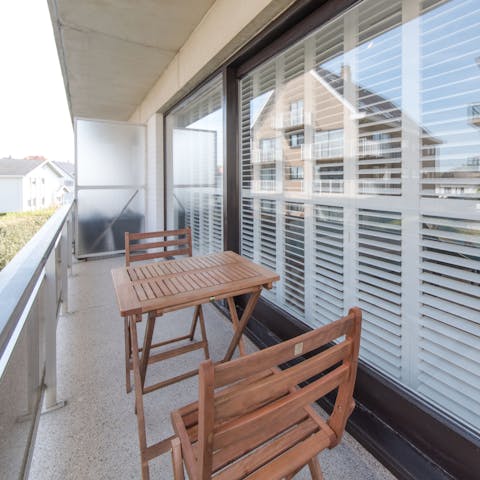 Enjoy your morning coffee on the private balcony before heading out for a day at the beach
