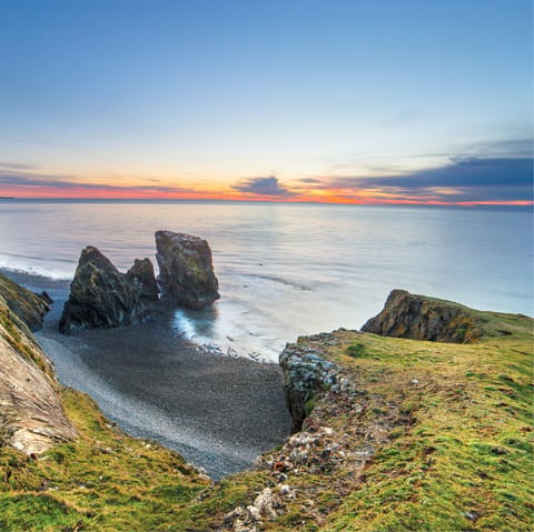 Admire the Trefor Sea Stacks – it's a forty-eight-minute drive