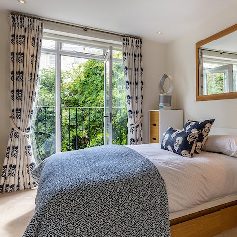 Open the doors and enjoy the leafy views across the garden
