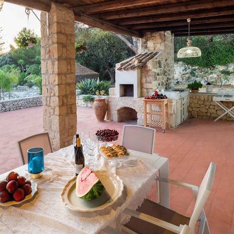 Dine al fresco on the covered loggia, complete with a small outdoor kitchen