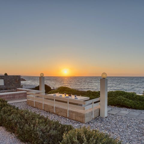Watch the sun set over the water from the communal dining area