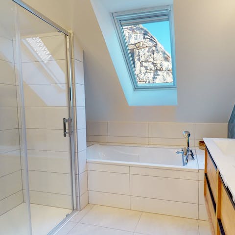 Sink into a hot bath under the skylight on a cosy evening