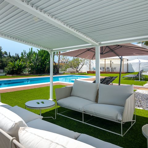 Take your pick from shady spots to recline beside the pool