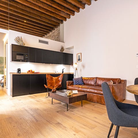 Kick back on the sofa with a glass of Spanish wine in the cool, beamed living area