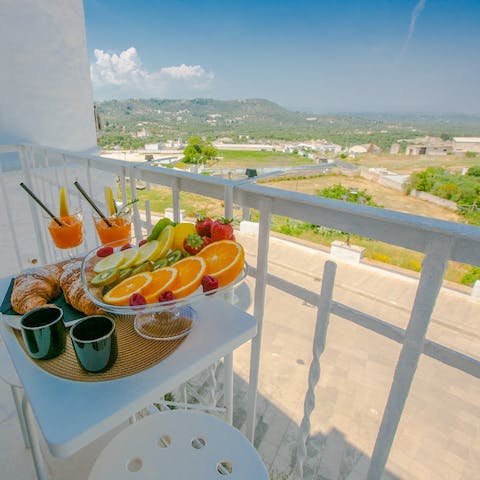 Lap up scenic views over Ostuni and the Adriatic Sea from the balcony
