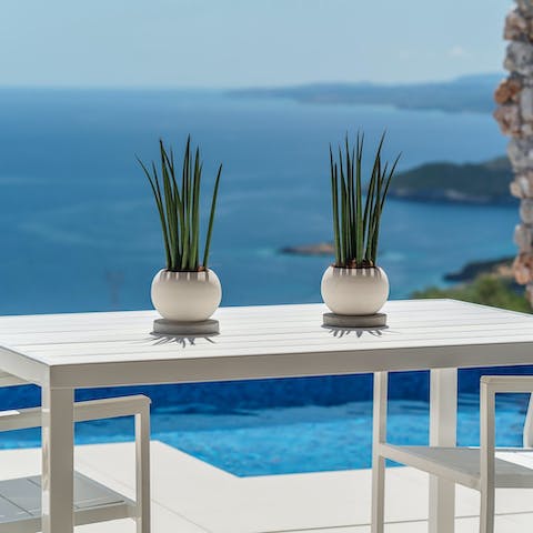 Enjoy a Greek salad and the sea views from the dining table