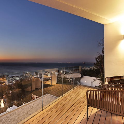 Take in glimmering sunset views from the private terrace 