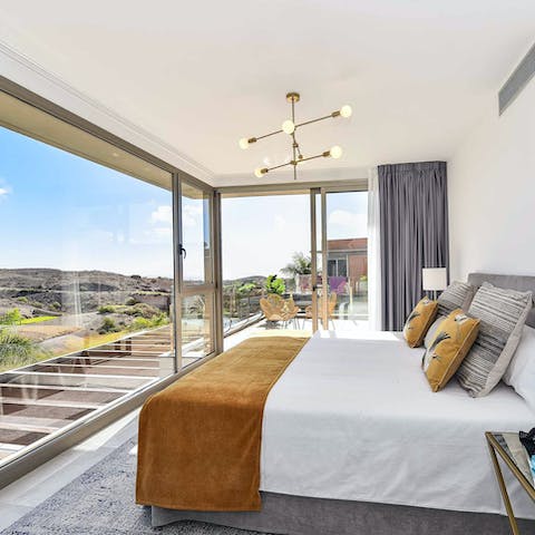 Enjoy views and plenty of sunlight with the main bedroom's floor-to-ceiling windows