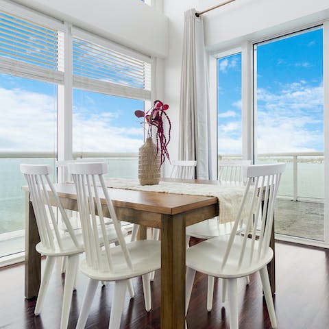 Enjoy meals and the wonderful views with family and friends at the dining table 