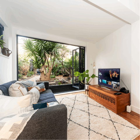 Cosy up in the living area with your favourite show on the TV