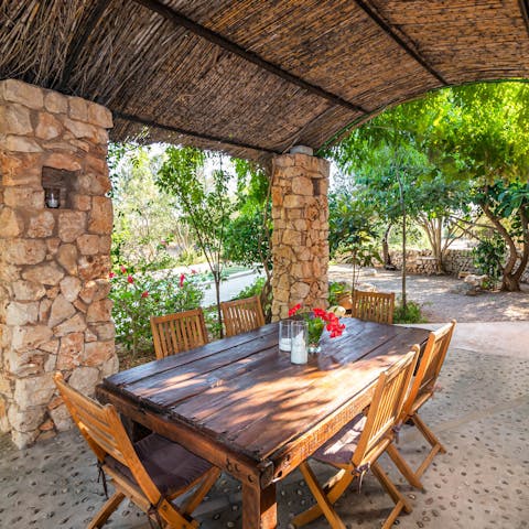 Tuck into home-cooked Mallorcan dishes in the shade