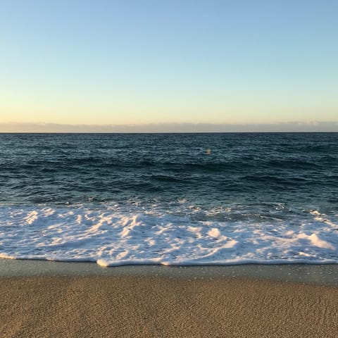 Relax on Calheta Beach, a ten-minute drive away