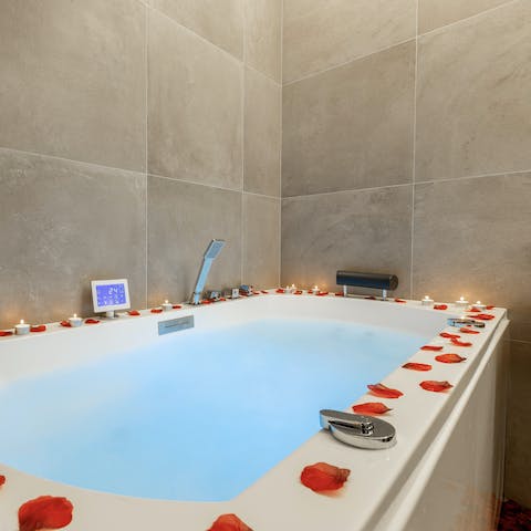 Unwind with a relaxing soak in the bathtub, a glass of champagne in hand
