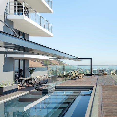 Have a dip in the shared pool on the 27th-floor roof terrace