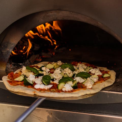 Tuck into a homecooked pizza made in the outdoor pizza oven