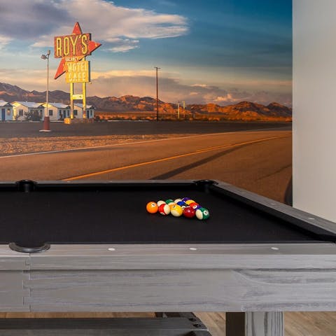 Enjoy a a pool tournament  in the games room