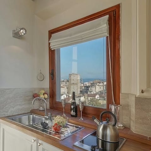 Enjoy stunning city views as you cook in the kitchen