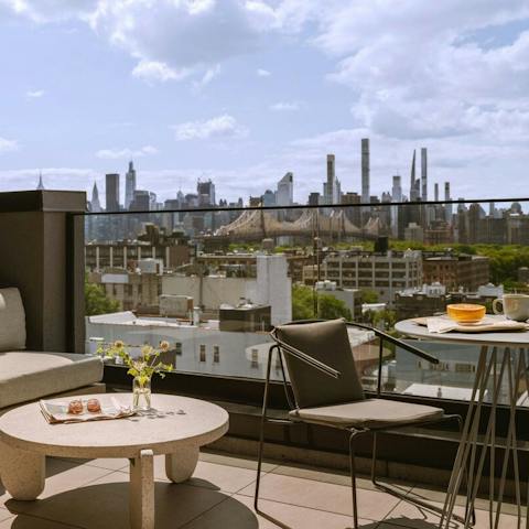Enjoy your morning coffee on the private balcony while drinking in views over the city skyline