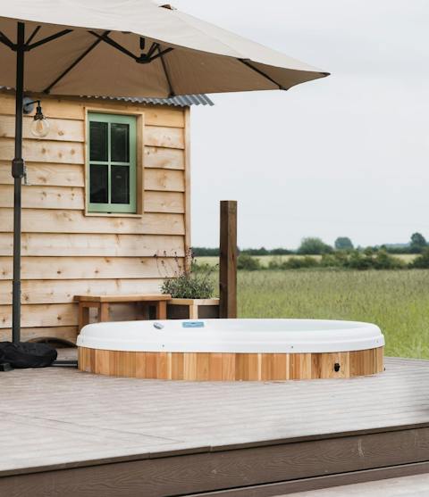 Take a luxurious dip in the outdoor hot tub – champagne optional