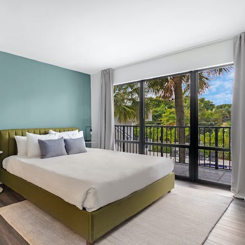 Wake up to beautiful palm-fringed views in the bedroom
