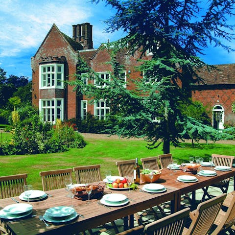 Tuck into memorable feasts prepared by a caterer in the garden