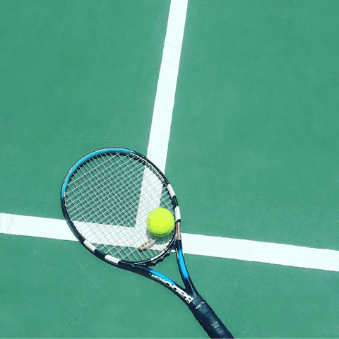 Challenge your loved ones to a few games of tennis on the courts