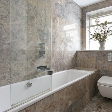Have a soak in the bath and sip a glass of fizz after a busy day in London