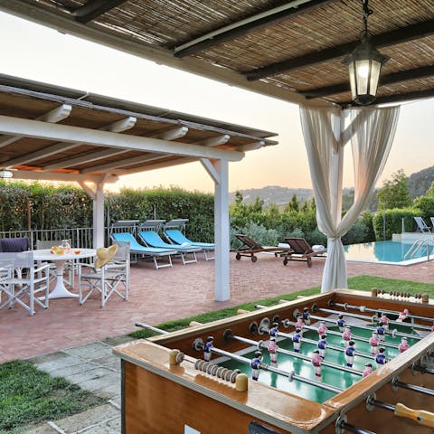 Seek some shade under one of the pergolas and play a game or two of foosball