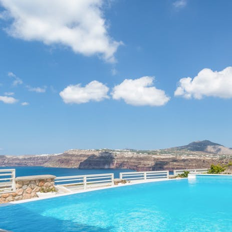 Swim to the infinity pool's edge to take in the obstructed view of the caldera, listening to the waves below