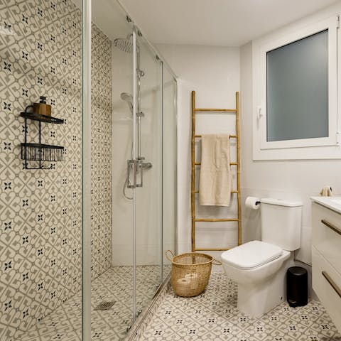 Take a luxurious shower in the tiled bathroom