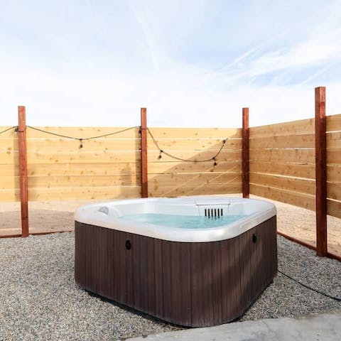 Enjoy a scenic desert soak in the private hot tub