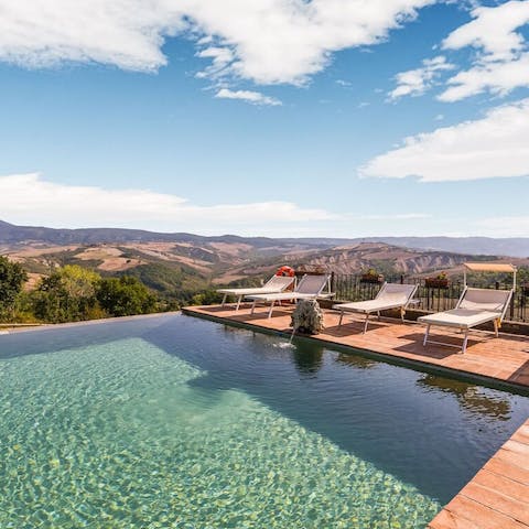 Take in incredibly views over the Tuscan hills from the sparkling shared infinity pool