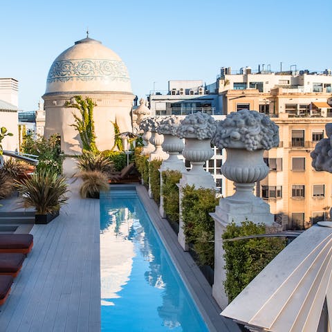 Take a refreshing dip in the shared rooftop pool