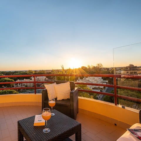 Toast the day's end with golden hour cocktails on the private balcony