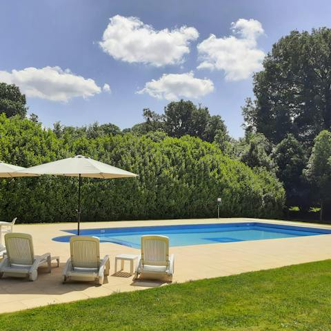 Spend the day poolside, surrounded by the lush garden