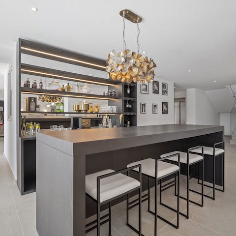 Shake up some cocktails at the home's modern bar