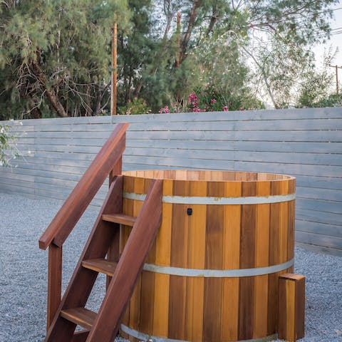 Soak in the cedarwood hot tub under the incredible stars