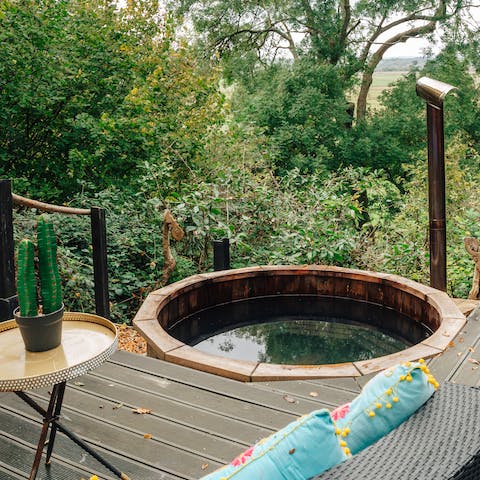Go for a relaxing soak in the wood-burning hot tub