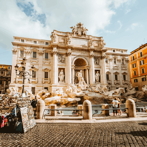 Toss a coin into the ornate and historic Trevi Fountain